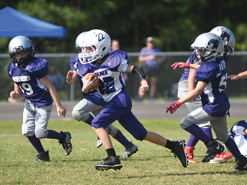 Gilmer third-grade running back Lance West (22) helped the Bobcats earn a 13-0 victory over the Dawson County Tigers last Saturday.