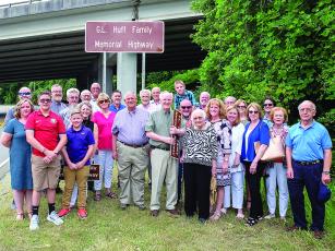 Family and friends of G.L. Huff Sr., G.L. Huff Jr. and Jim Huff join Georgia House Speaker David Ralston to unveil a commemorative marker along Highway 52 in East Ellijay. 