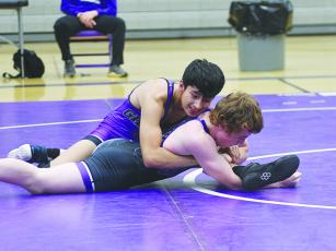 Gilmer High senior Arturo Gonzales (in purple) earned a win over a third-place state finisher from Adairsville in his 120-pound match at last Saturday’s Blackbeard Duals.