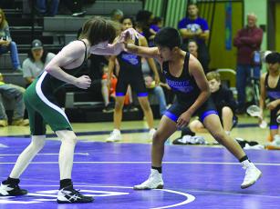 Clear Creek’s Nelson Jacinto (right) earned a pin last Thursday versus Lumpkin County to help the Bobcats come away with a 70-12 victory.