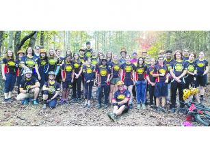 Above are riders and coaches of the Gilmer Cartecay Youth Mountain Bike Team before they hit the trail.