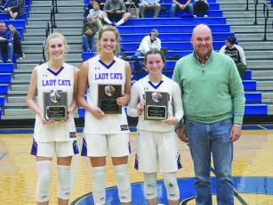 Pictured with ETC’s Jason Smith are Lady Cat all-tournament players Lark Reece, Elly Callihan and Charley Poteet.