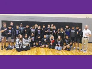 Gilmer High wrestlers, coaches and managers are pictured following the Bobcats’ first-place finish at the North Murray Duals last Saturday.