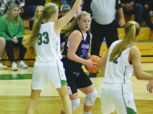 Lady Cat Lucy Ray (34) operates in the post and scored at least eight points in each of Gilmer’s three games last week .