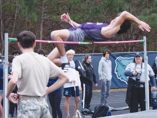 Gilmer Bobcat Isaac Freeman clears 5’ 6” in the high jump at last Friday’s Creekview Invitational to finish third.