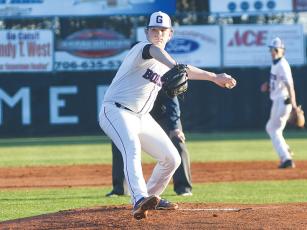 Gilmer High senior Grant Cochran delivers a pitch last Thursday and tossed a gem versus North Hall. He held the Trojans scoreless and struck out six in seven innings.