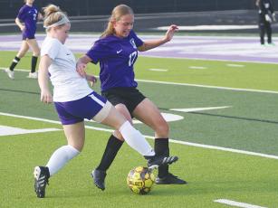 Gilmer High senior Mattie Bryant (17) fends off a Union County Panther during last Wednesday’s match.