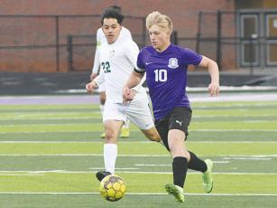 Gilmer High senior Julien Withrow runs away from a defender and scored two goals in the Bobcats’ 3-1 victory versus Lumpkin County.