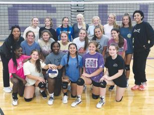 Above are Gilmer High volleyball players and All-American camp coaches. GHS held the annual camp last week.