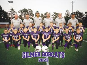Gilmer second-grade football players and coaches