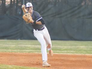 Bobcat shortstop Eli Cooper makes a throw to first for an out last Monday versus Fannin County. 