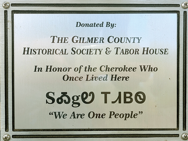 The plaque dedicating the park bench 