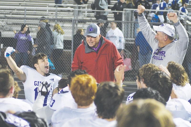 Above, center, Walker fires up Bobcats and current head coach Paul Standard (right) following Gilmer's state playoff win versus Adairsville in 2023. 