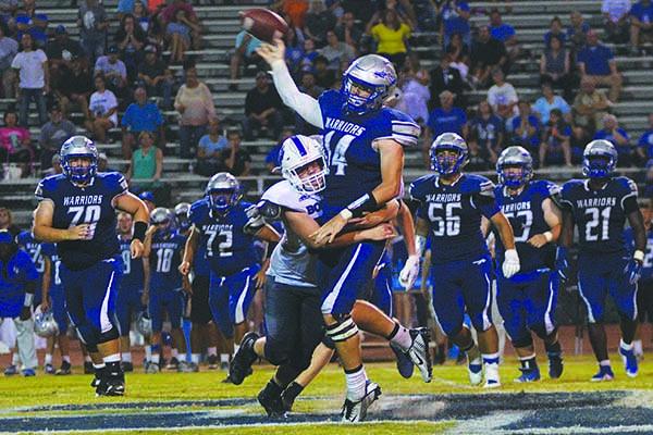 Gilmer High’s defensive pressure in the fourth quarter helped preserve its 6-3 win over Gordon Central last Friday. Above, Bobcat Will Bradburn disrupts a pass on the Warriors’ final drive.