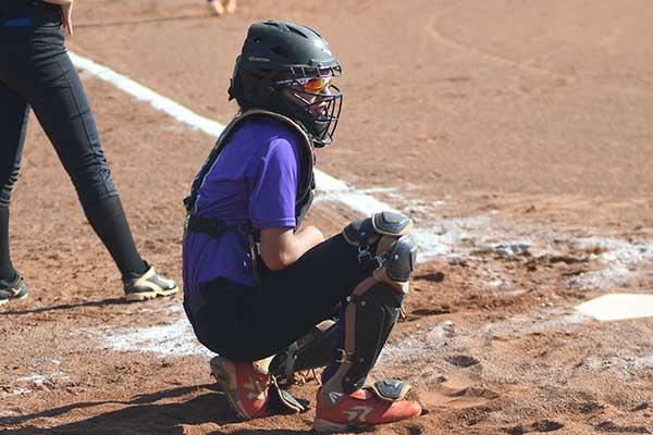 Gilmer High catcher Maddie Wright gets the sign from the dugout and has been one of three freshmen who have started for GHS this season.