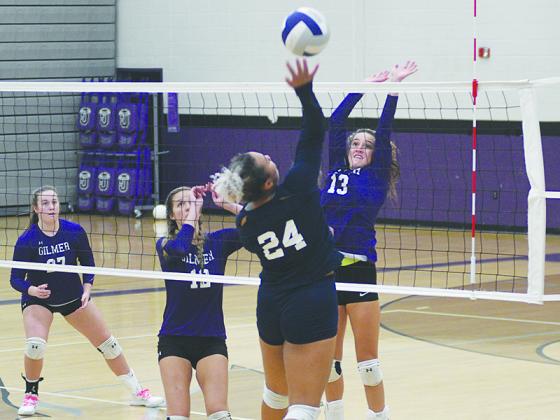 Gilmer’s Beth Burnette (13) goes up for a block during last Thursday’s match against White County.