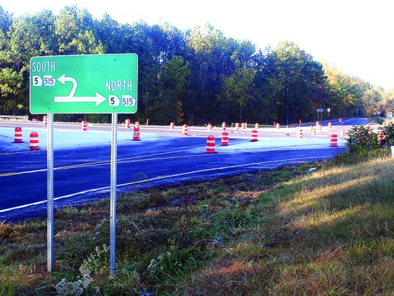 A sign marks new U-turn lanes near the intersection of Antioch Church Road and Highway 515 just south of the Gilmer/Pickens County line.