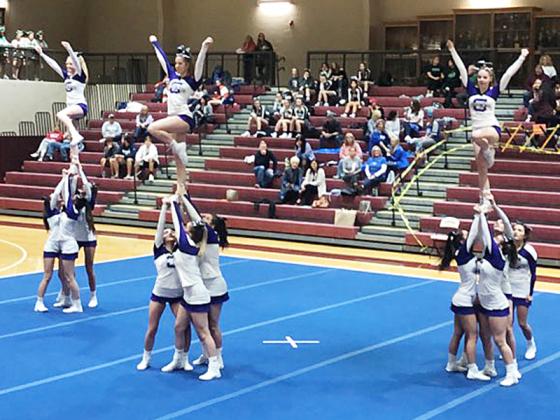 Gilmer cheerleaders take the floor for a final time before Saturday’s region competition.