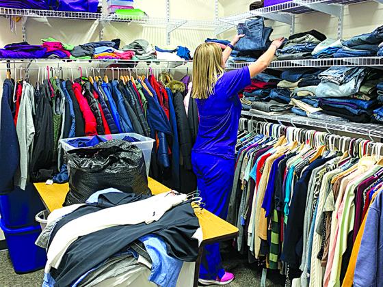 Gilmer High nurse Jade Davis organizing the school’s clothes closet.