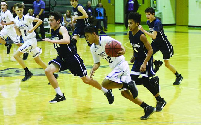 Clear Creek’s Jacob Becerra pushes the ball up court and scored 13 points in the Bobcats’ league tournament win over Fannin County.