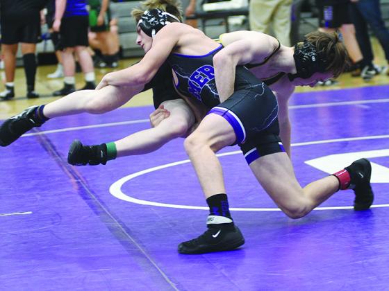 Gilmer’s Carson Bentley takes his opponent to the mat and placed third in the 113-pound weight class at the Murray County Invitational.