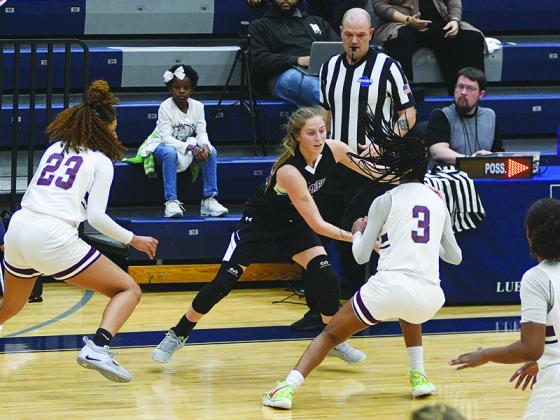 Bailey Teague searches for an open teammate.