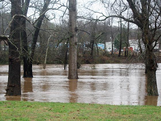 Ellijay River Park including the walking trail, shown here, is closed till further notice due to flood conditions. The park entrances on South Main Street have been roped off.