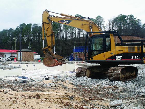 A concrete walkway that surrounds the county pool was broken into chunks of rubble as demolition of the swimming pool behind the Gilmer Civic Center continued last week.