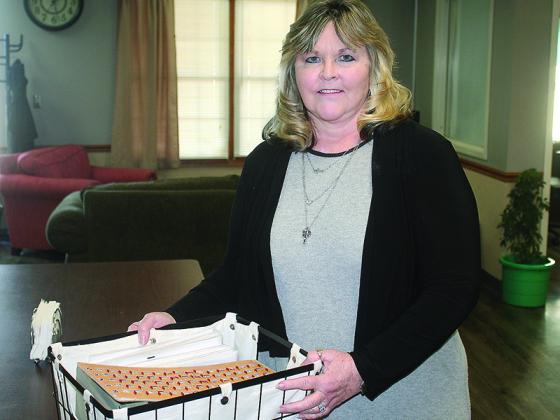 Vicky Stonecipher, the Gilmer Senior Center’s new site manager, sets up a bingo game at the downtown Ellijay place for senior citizens age 60 and over.