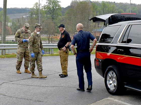 National Guard members are pictured above with Gilmer County Public Safety information officer Al Cash and fire chief Dan Kauffman.