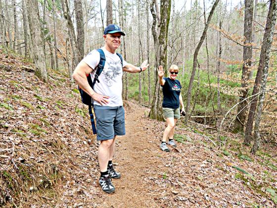 Ron and Laura Sturgis practice social distancing in the woods.