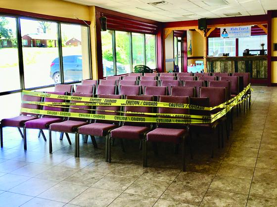 Seating in the facility’s waiting area has been taped off and only five clients enter the building at a time.