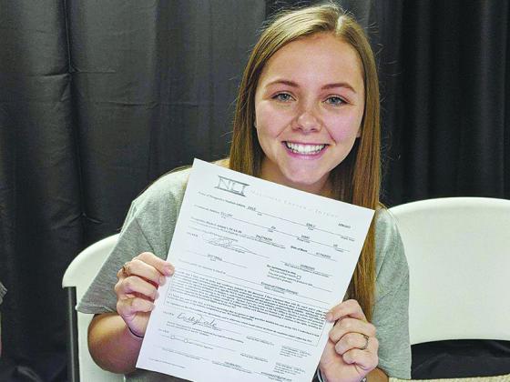 Emily Dale accepted a scholarship to attend Emmanuel College and play softball for the Lions.