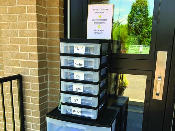 Pictured are free books and optional summer enrichment activities at the front entrances of Gilmer County Schools. Activities were constructed to be fun and engaging and keep students’ academic skills sharp over summer break.