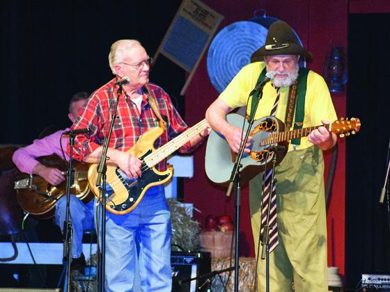 Vic Davis, left, performs at the 2009 Ellijay Heart Fund Show with longtime friend Ed Forrester, dressed as his country comedy character Elmo Pickhandle.