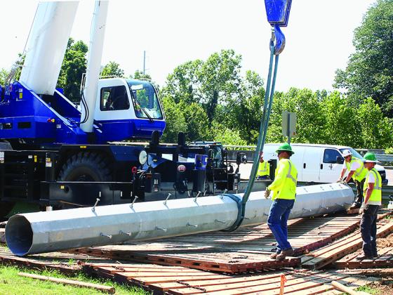 Employees of a contracted company work to install a power transmission line pole during construction of Georgia Transmission’s Ellijay-Roundtop Road 230-kV project in 2016. Georgia Transmission plans to begin construction of its Whitepath 46-kV sub-transmission line project in 2022.