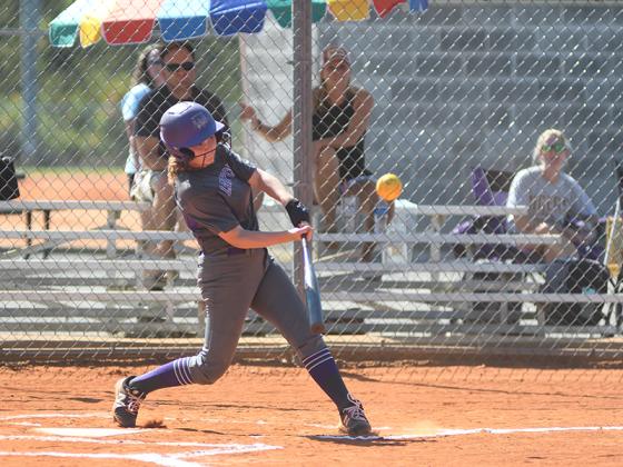 Clear Creek’s Sierra Williams smacks a triple for the Lady Cats in last Tuesday’s game against Dawson County.