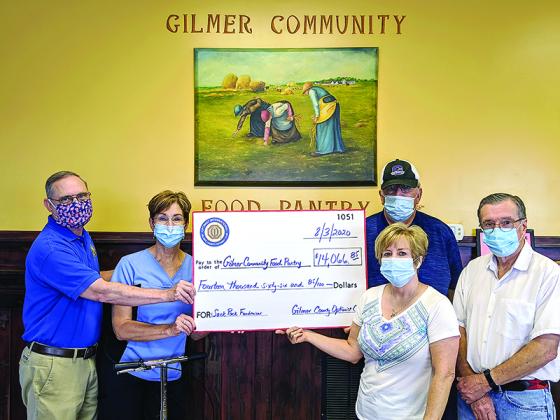 Pictured, from left, are: Trent Sanford (Optimist Club president), Kathy Romanick (Optimist Club fundraiser event chair), Paul Bryant (food pantry volunteer), Lu Hale (food pantry Sack Pack coordinator) and Allen Triebel (food pantry executive director). 