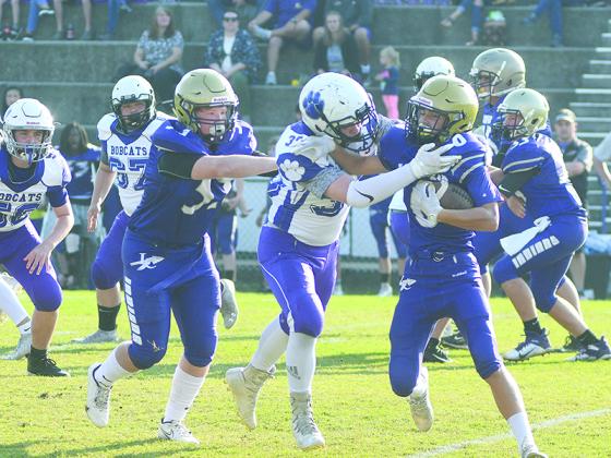 Clear Creek eighth grader Wyatt Stokes makes a tackle for a loss against Lumpkin County last Thursday.