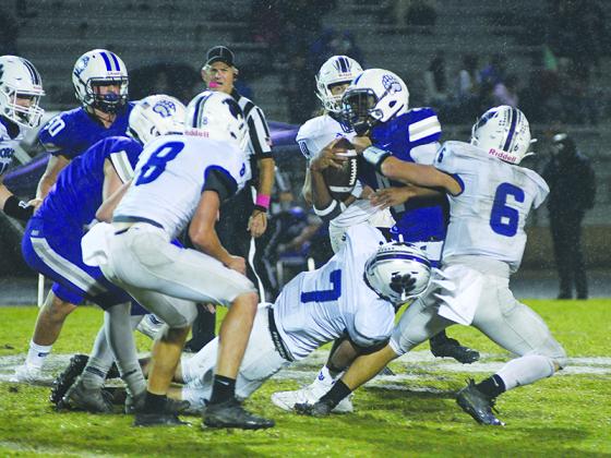Gilmer safeties Hunter Watkins (7) and Spenser Smith (6) bring down Cherokee Bluff’s Charles Tolbert last Friday.