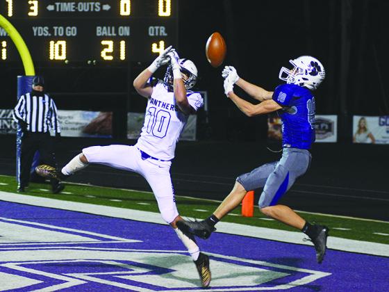 Union County’s Eli Peugh (left) breaks up a pass in the end zone intended for Gilmer’s Will Kiker. The play occurred with 23 seconds left in the fourth quarter of last Thursday’s game.