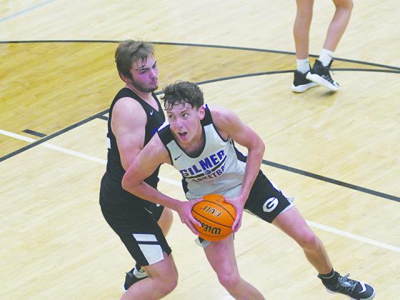 Bobcats Lewis Mulkey (in white) and Gavin Berger (black) go at it in the post, and both return to Gilmer’s varsity roster this season.