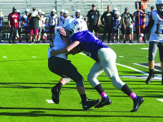 Peyton Chancey (18) makes a tackle for an 8-yard loss versus Dawson County last Saturday. Offensively, he had a 57-yard touchdown run in the first quarter. 