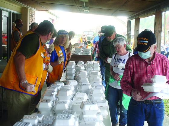 Event attendees receive curbside service from Ellijay Lions during a complimentary lunch for veterans and guests that followed the program.
