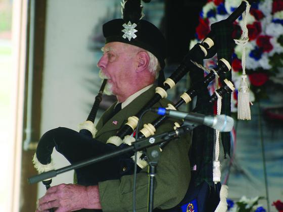 George McClellan performs “Amazing Grace” on the bagpipes as the program concludes.