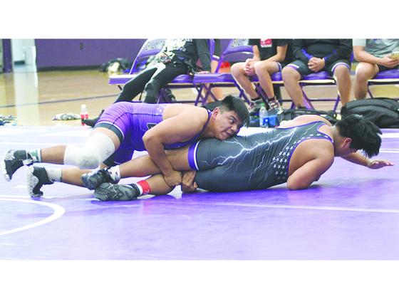 Gilmer High School senior Abel Jacinto (left) is one of five returning state placers off last season’s team that finished second at the state duals and traditional tournaments.