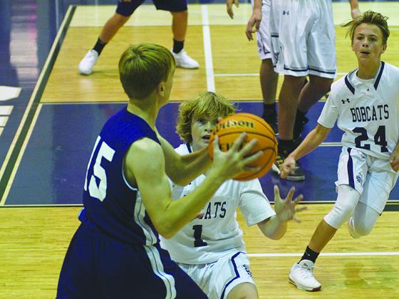 Eighth-grade Bobcats J.D. Taylor (1) and Cooper Farmer (24) defend the perimeter and helped CCMS improve to 9-0 last week.
