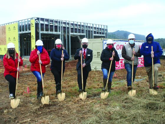 Representatives from MainStreet Family Care (MSFC) join Gilmer Chamber and Joint Development Authority personnel in front of a new urgent care clinic now under construction in East Ellijay. Pictured, from left: Abigail Long (MSFC), Chamber Ambassador Joyce Kosirowsky, Betsy Stewart (MSFC), Joint Development Authority Director Kent Sanford, Chamber Membership Manager Ellen Grant, Chamber Board Chair Elect Bobby McNeill and Past-Chair John Marshall.