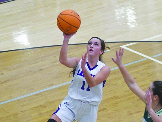Senior Lady Cat Beth Burnette drives for two points and scored 12 against Coahulla Creek last Tuesday.