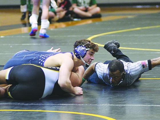 Gilmer Bobcat wrestler Hunter Brown secured a win for GHS last Saturday as the Bobcats qualified for the Class 3A state duals.